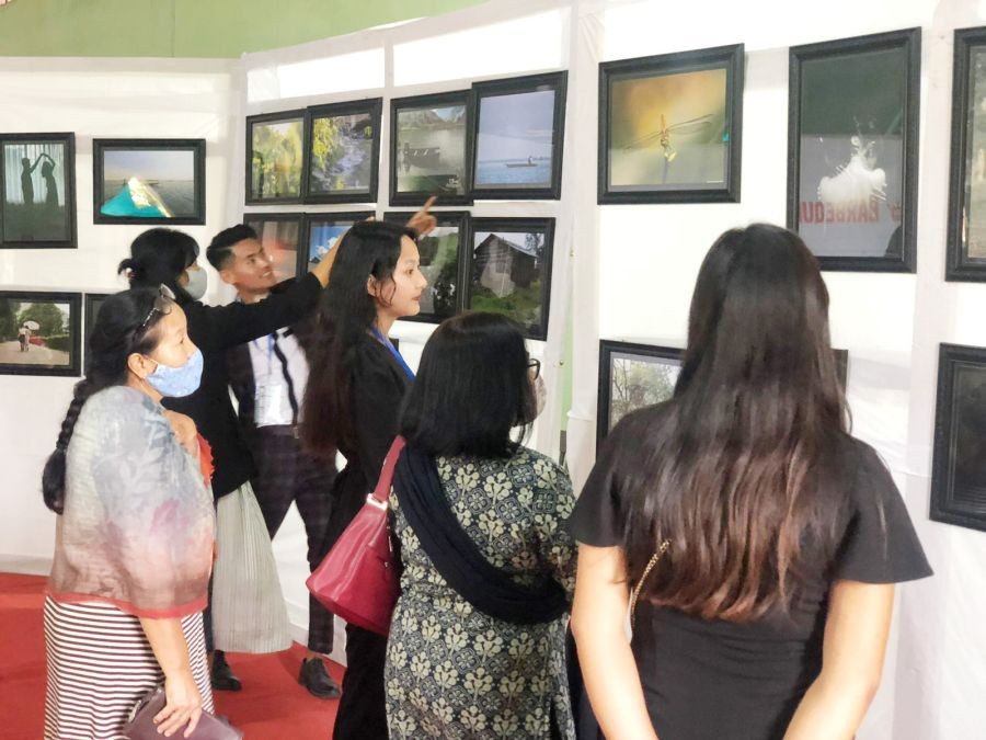 Visitors view the photos on display at the ‘Into the Roots’ photography exhibition organised by the 3rd year students of the Department of Multimedia and Mass Communication, Patkai Christian College (Autonomous) at the Bundrock Memorial Chapel, Patkai on April 30. (Morung Photo)